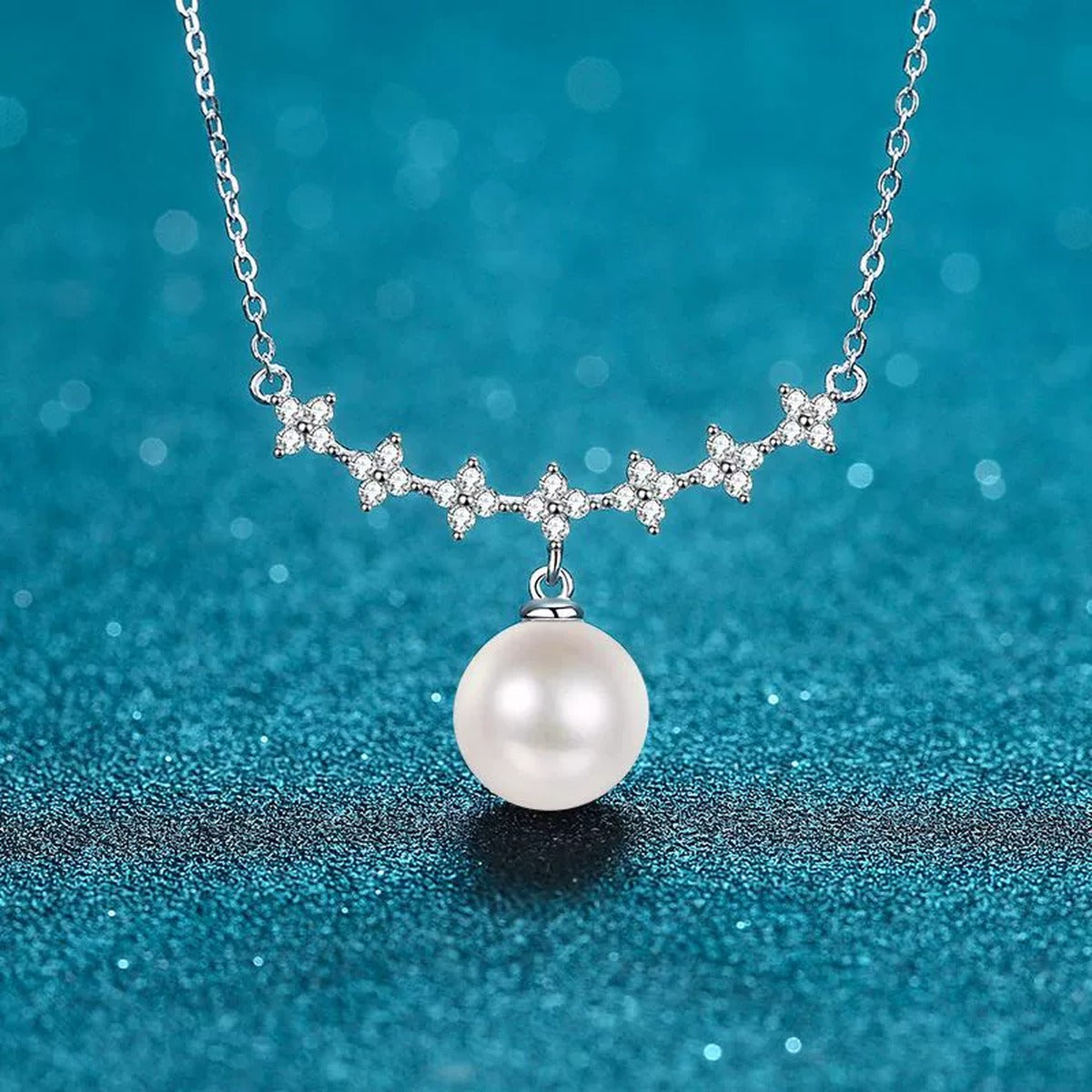 Clover Moissanite Pearl Pendant Necklace in Rhodium-Plated S925 sterling silver blue display scene showing chain and stone layout