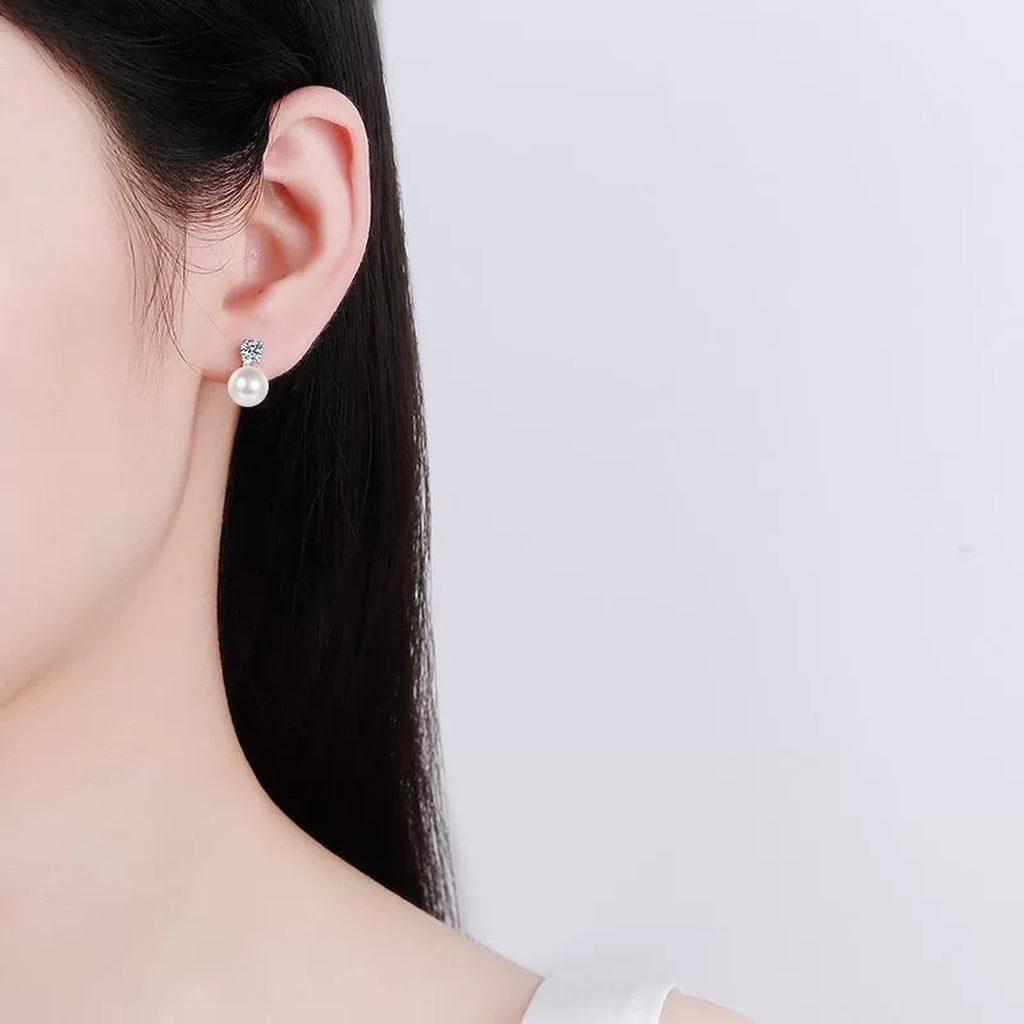 Square Cluster Moissanite Pearl Stud Drop Earrings in Rhodium-Plated S925 sterling silver worn on ear by model showing scale, placement, and stud earrings styling