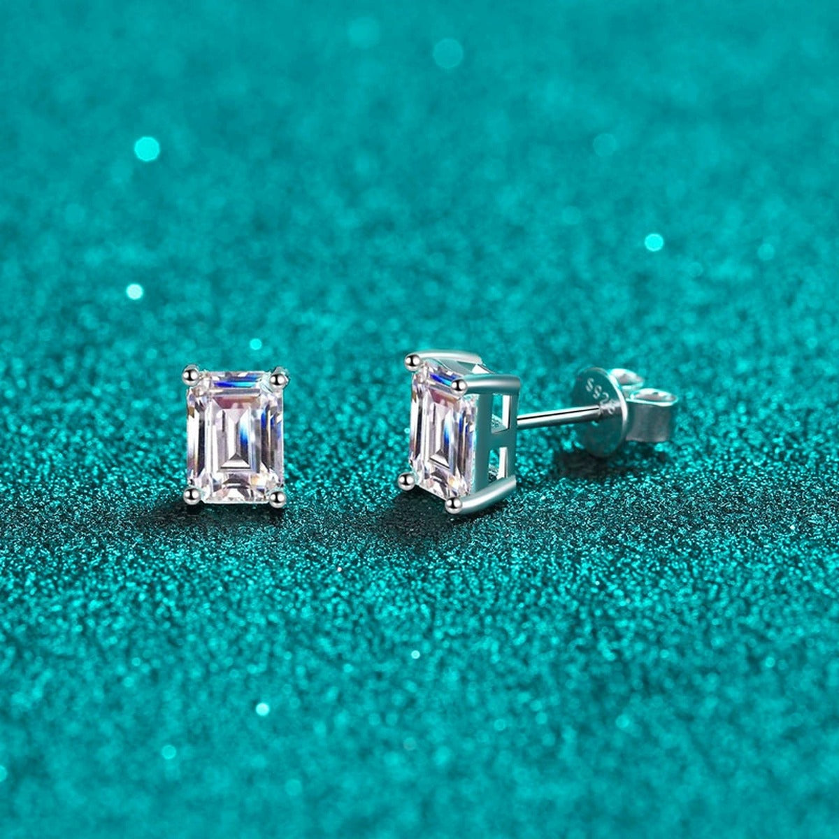 Emerald and Radiant Cut Moissanite Stud Earrings in Rhodium-Plated S925 sterling silver product scene view showing angled setting detail