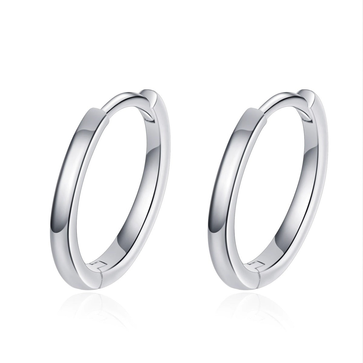 Minimal Huggie Hoop Earrings in Rhodium-Plated S925 sterling silver on white background showing the full pair, polished huggie hoop shape, and huggie hoop earrings silhouette