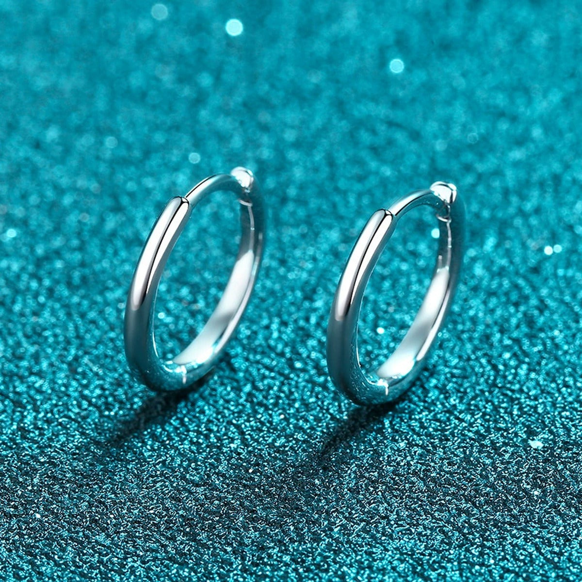 Minimal Huggie Hoop Earrings in Rhodium-Plated S925 sterling silver product scene view showing angled setting detail