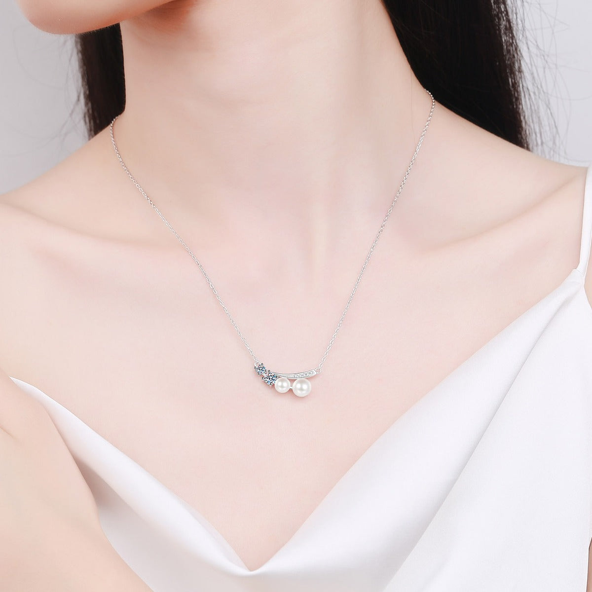 Bow Moissanite Pearl Pendant Necklace with CZ in Rhodium-Plated S925 sterling silver neckline model view showing pendant scale and adjustable chain