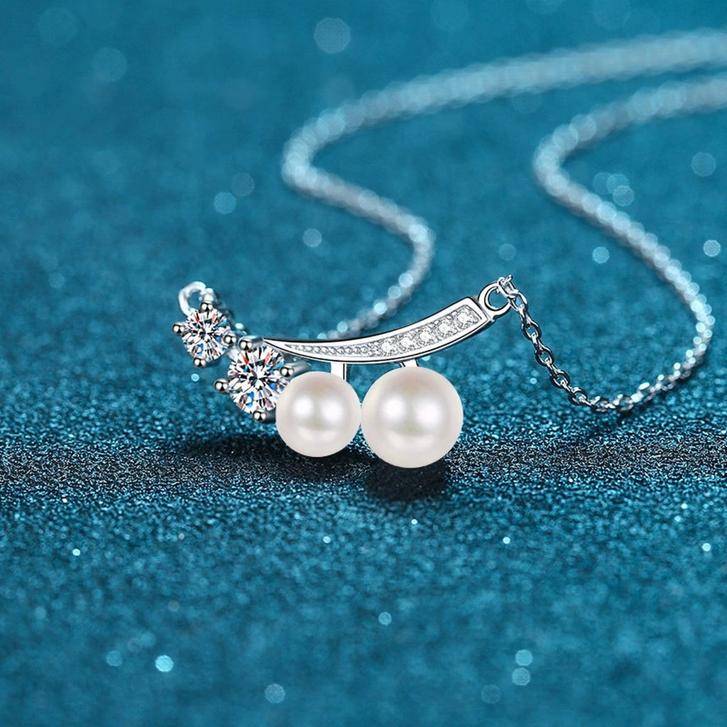 Bow Moissanite Pearl Pendant Necklace with CZ in Rhodium-Plated S925 sterling silver blue display scene showing chain and stone layout