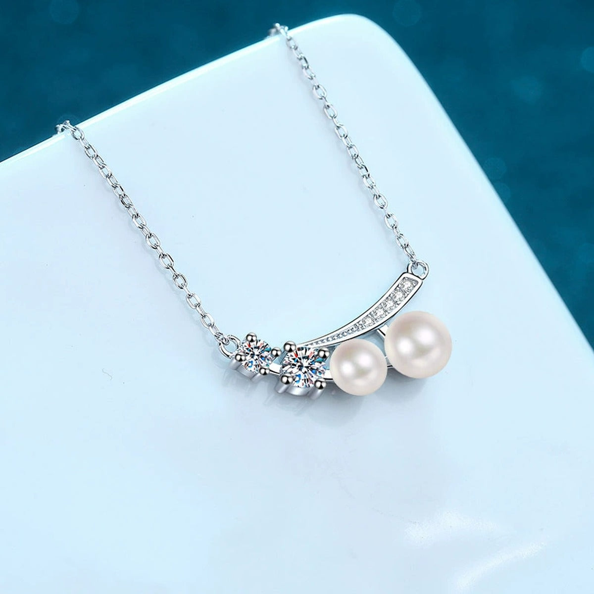 Bow Moissanite Pearl Pendant Necklace with CZ in Rhodium-Plated S925 sterling silver angled product detail view