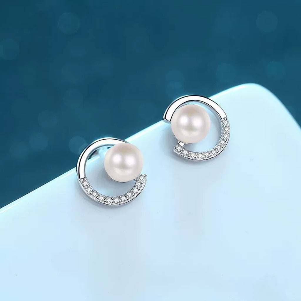 Crescent Pearl Moissanite Stud Earrings in Rhodium-Plated S925 sterling silver product scene view showing angled setting detail