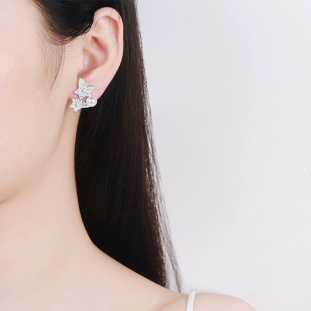Leaf Pearl Moissanite Stud Earrings in Rhodium-Plated S925 sterling silver worn on ear by model showing scale, placement, and stud earrings styling