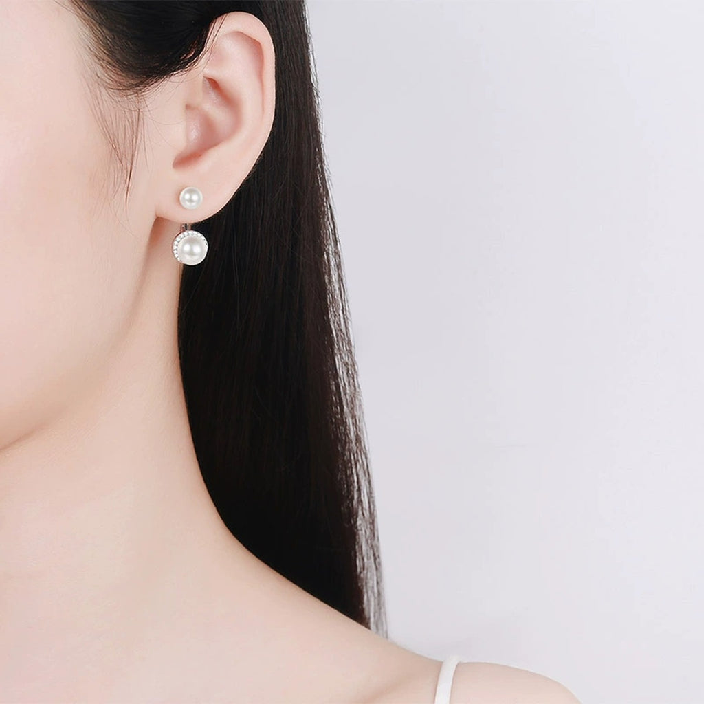 Double Pearl Moissanite Stud Drop Earrings in Rhodium-Plated S925 sterling silver worn on ear by model showing scale, placement, and stud earrings styling