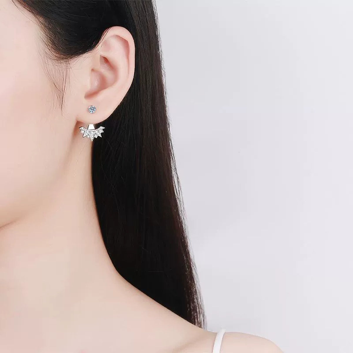 Starburst Moissanite Stud Drop Earrings with CZ in Rhodium-Plated S925 sterling silver worn on ear by model showing scale, placement, and stud earrings styling