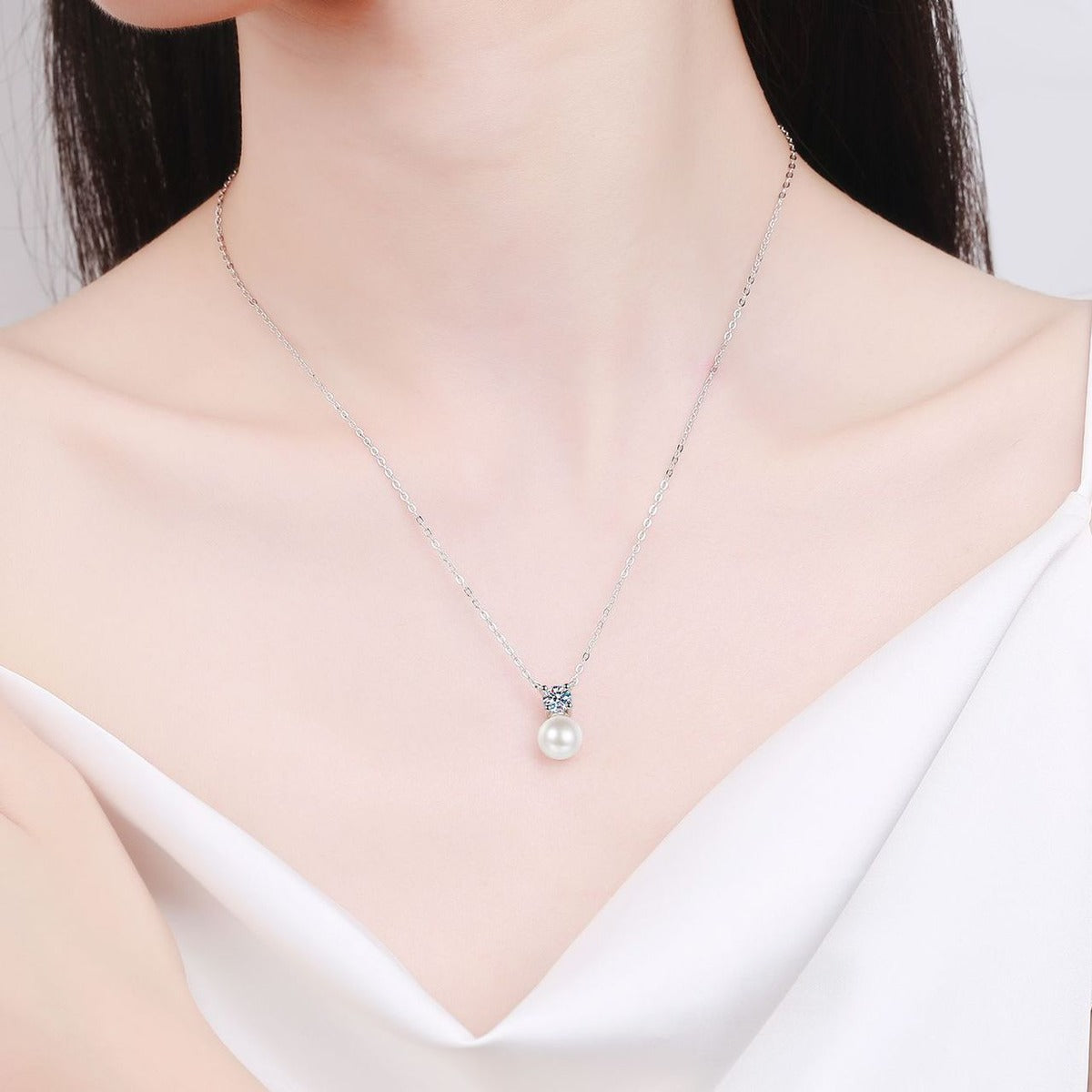 Round Moissanite Pearl Pendant Necklace in Rhodium-Plated S925 sterling silver neckline model view showing pendant scale and adjustable chain