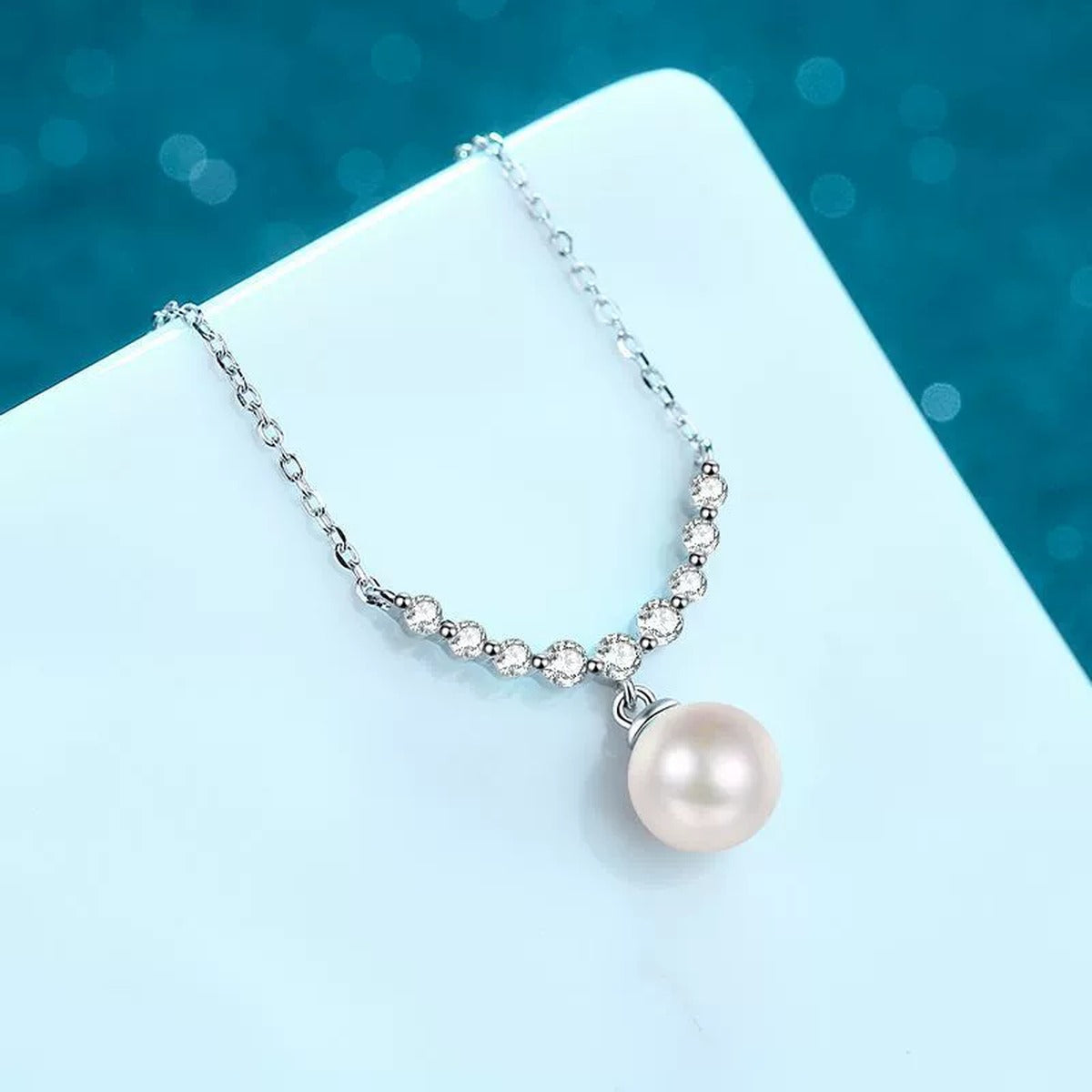 Smile Moissanite Pearl Pendant Necklace in Rhodium-Plated S925 sterling silver angled product detail view