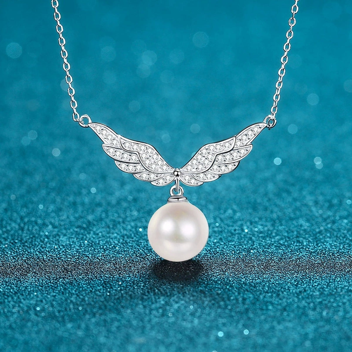 Angel Wing Moissanite Pearl Pendant Necklace in Rhodium-Plated S925 sterling silver close-up product scene showing pendant setting