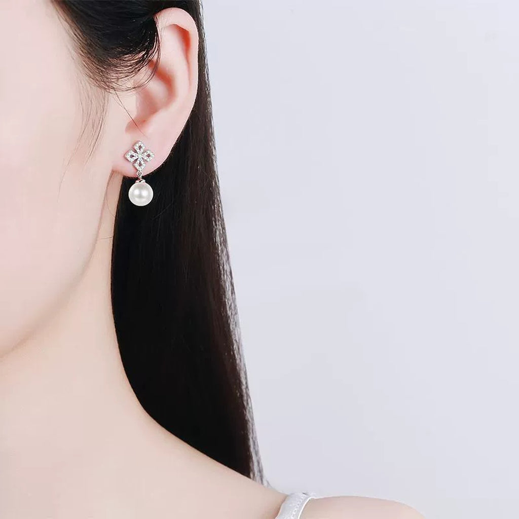 Leaf Cluster Pearl Moissanite Stud Dangle Earrings in Rhodium-Plated S925 sterling silver worn on ear by model showing scale, placement, and stud dangle earrings styling