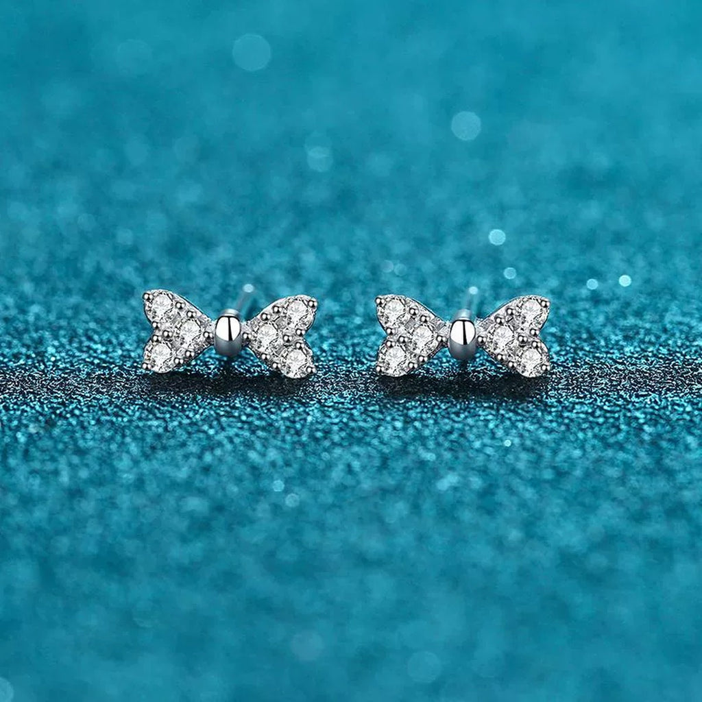 Bow Moissanite Stud Dangle Earrings in Rhodium-Plated S925 sterling silver product scene view showing front detail