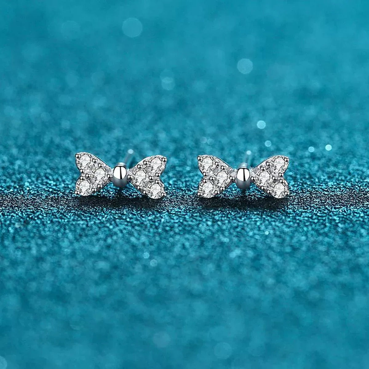 Bow Moissanite Stud Dangle Earrings in Rhodium-Plated S925 sterling silver product scene view showing front detail