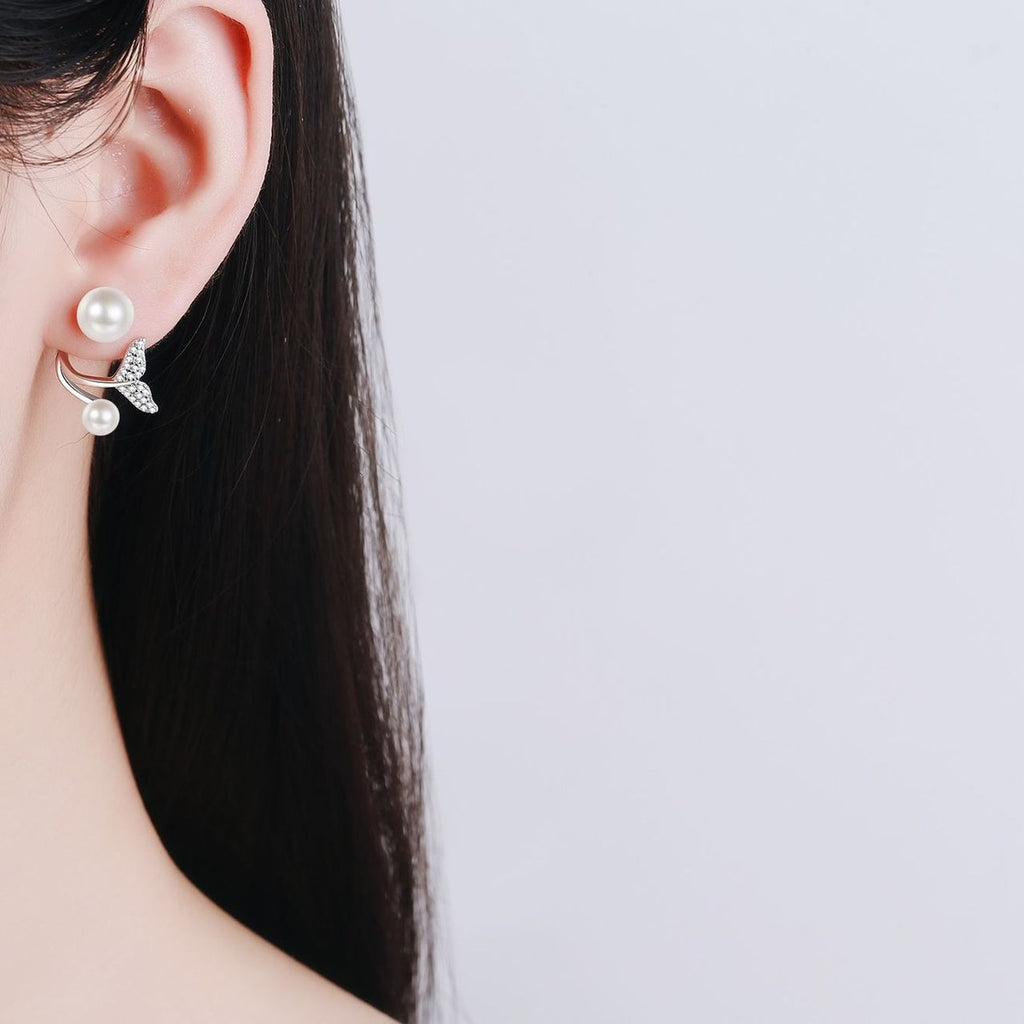 Mermaid Tail Pearl Moissanite Stud Drop Earrings in Rhodium-Plated S925 sterling silver worn on ear by model showing scale, placement, and stud earrings styling