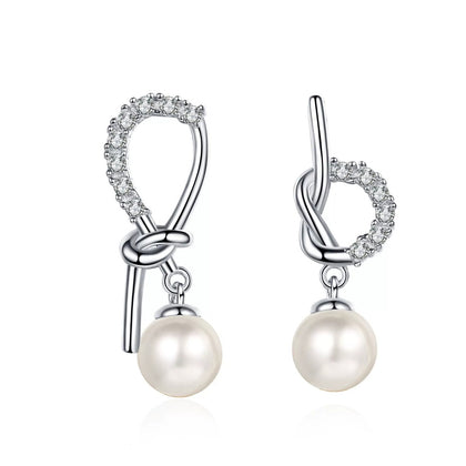 Ribbon Bow Pearl Moissanite Stud Dangle Earrings in Rhodium-Plated S925 sterling silver on white background showing the full pair, pearl and moissanite detail, and stud dangle earrings silhouette