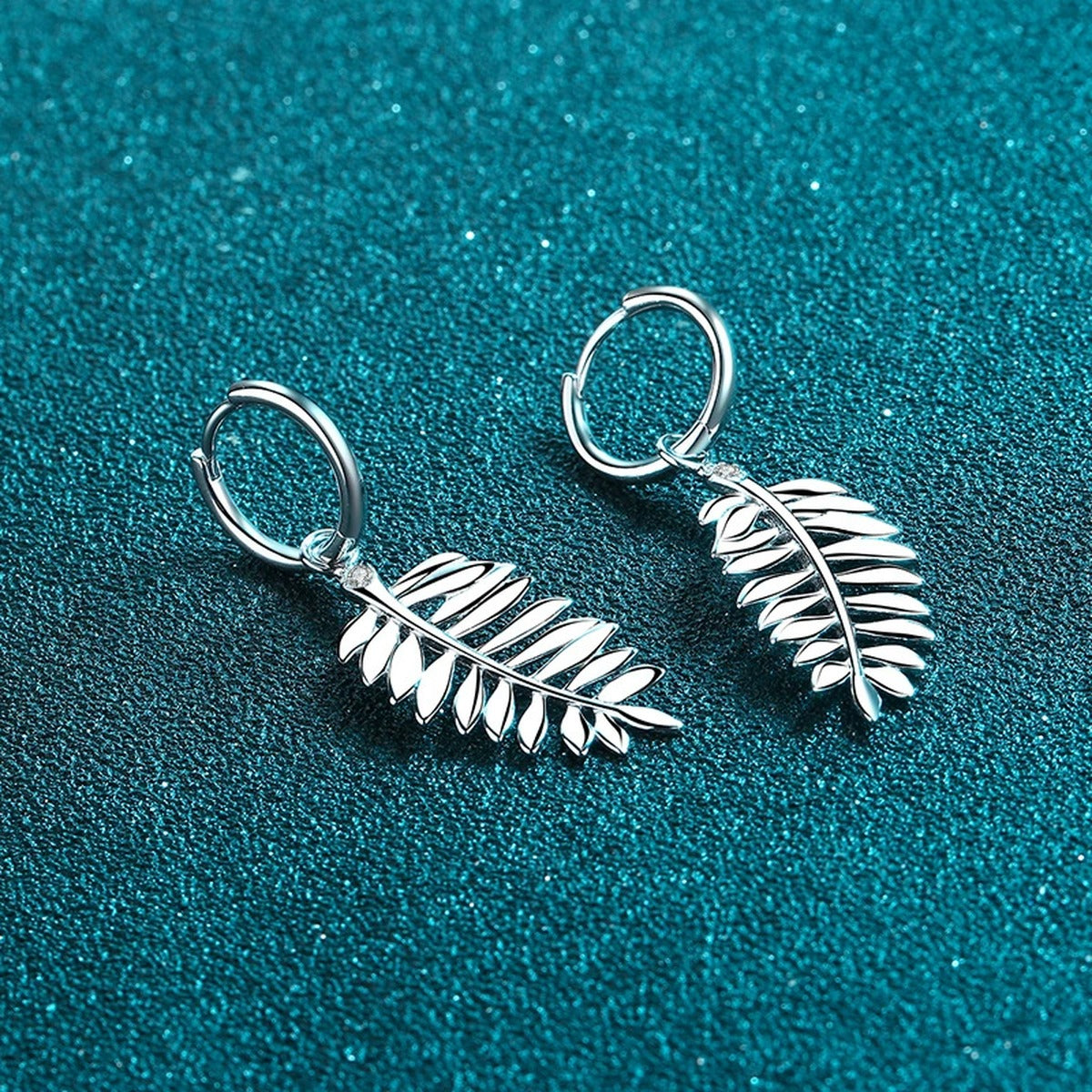 Feather Moissanite Hoop Dangle Earrings in Rhodium-Plated S925 sterling silver product scene view showing angled setting detail