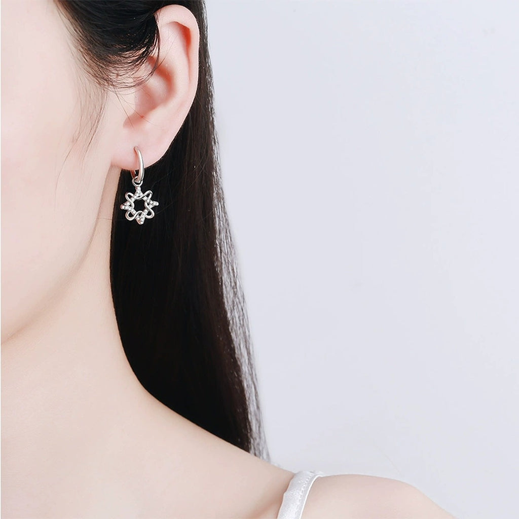 Floral Moissanite Hoop Dangle Earrings in Rhodium-Plated S925 sterling silver worn on ear by model showing scale, placement, and dangle earrings styling