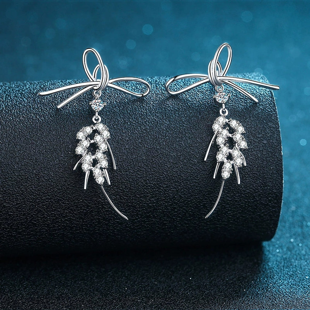 Bow Moissanite Stud Dangle Earrings in Rhodium-Plated S925 sterling silver product scene view showing front sparkle