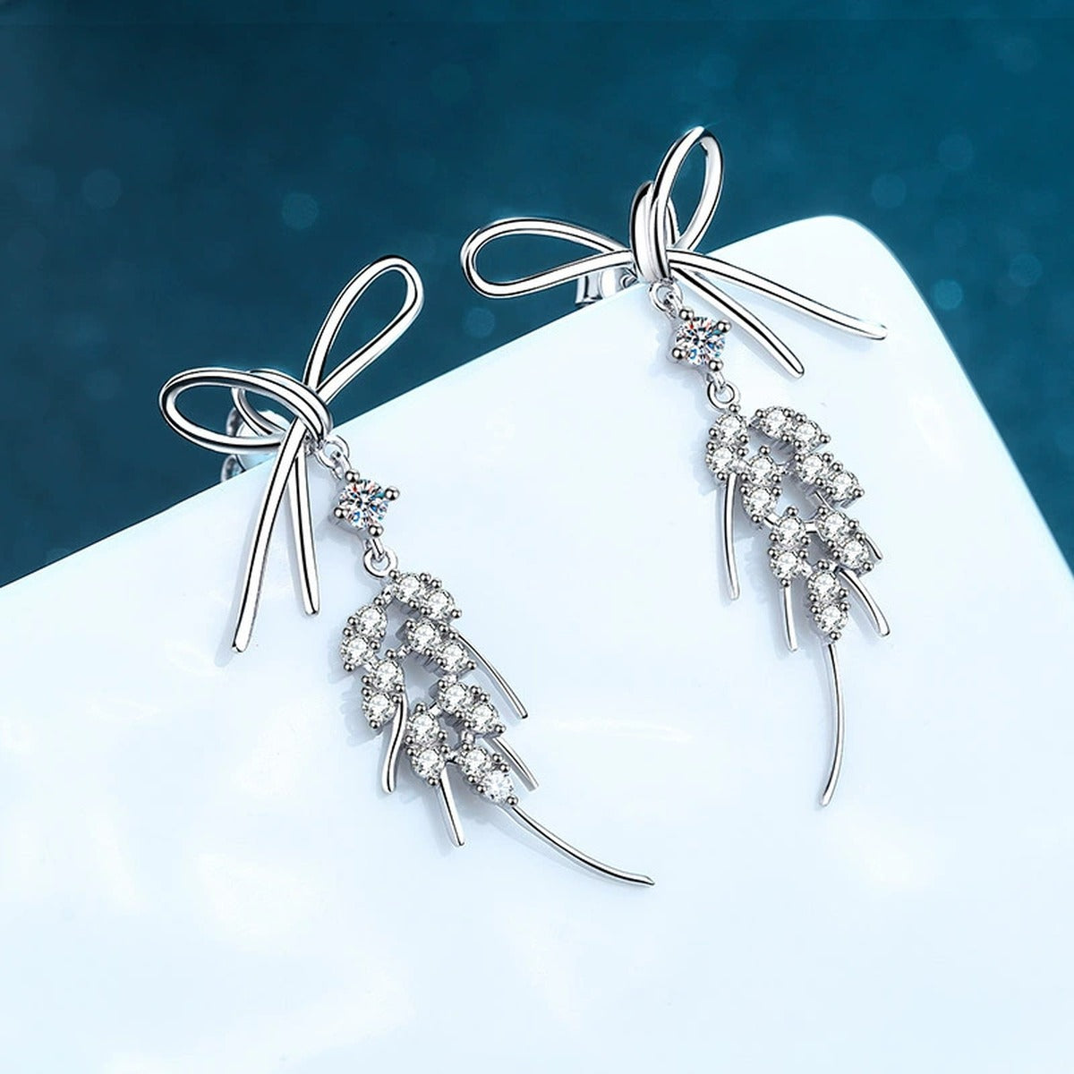 Bow Moissanite Stud Dangle Earrings in Rhodium-Plated S925 sterling silver product scene view showing side profile