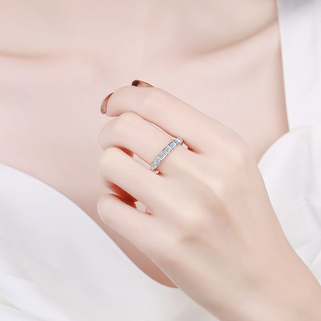 Princess Cut Moissanite Solitaire Ring worn on hand to show scale and ring profile