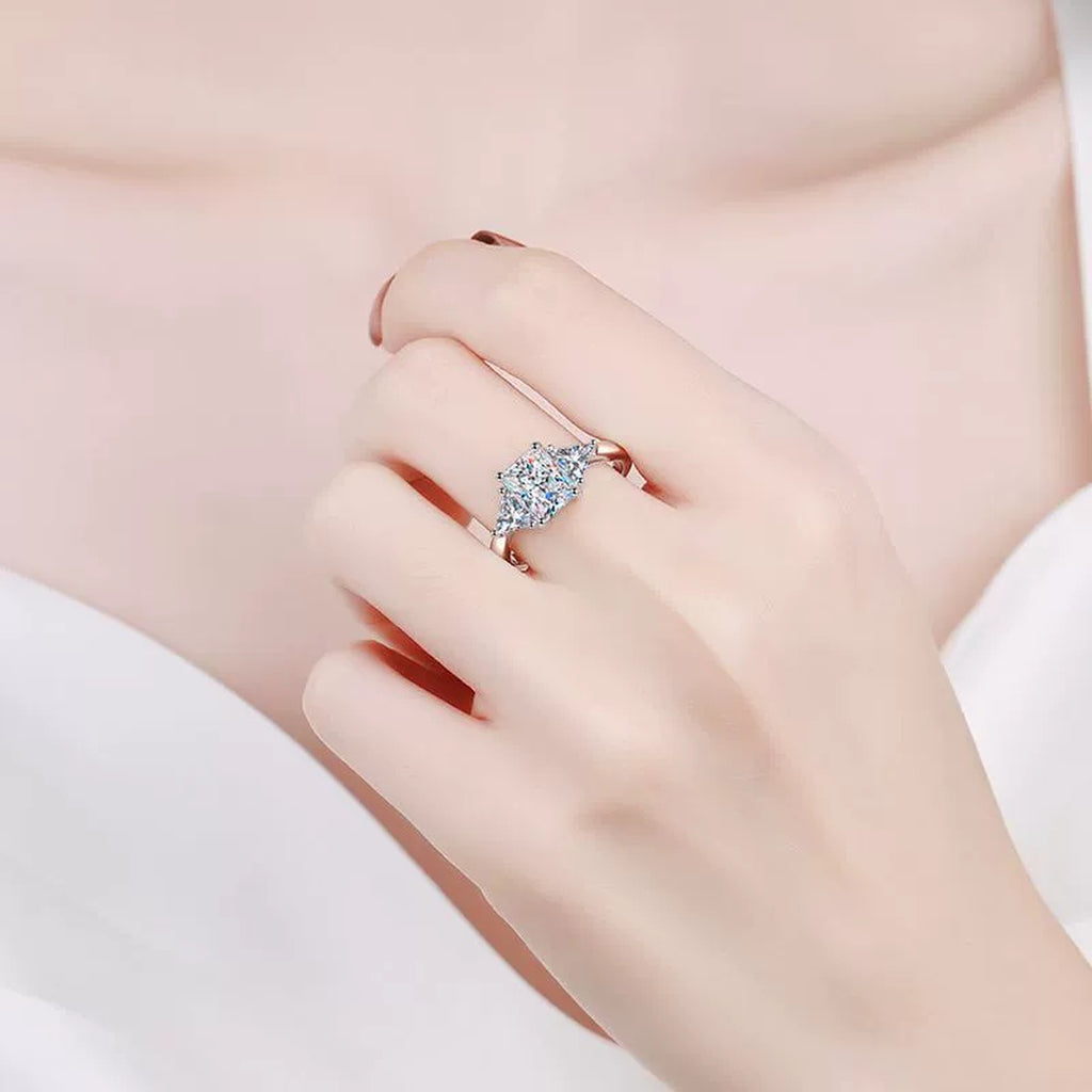 Emerald and Radiant Cut Moissanite Ring worn on hand to show scale and ring profile