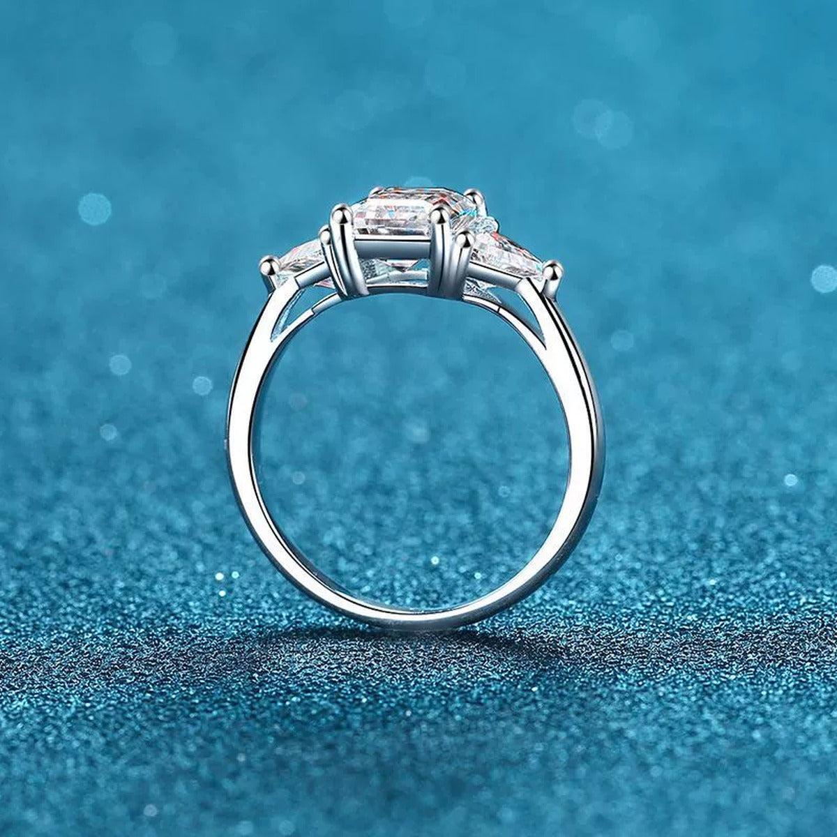 Emerald and Radiant Cut Moissanite Ring product view showing moissanite setting and rhodium finish