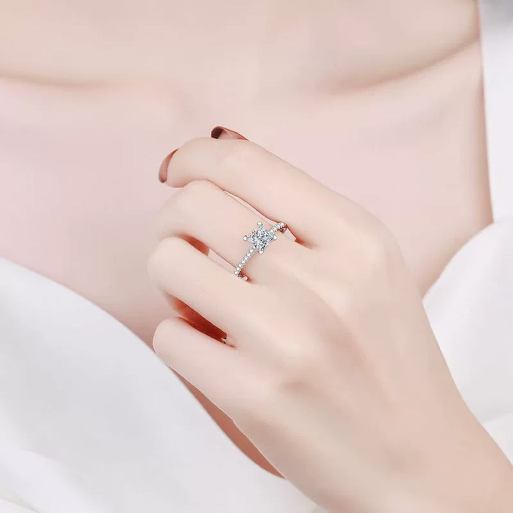 Princess Cut Moissanite Ring with CZ worn on hand to show scale and ring profile