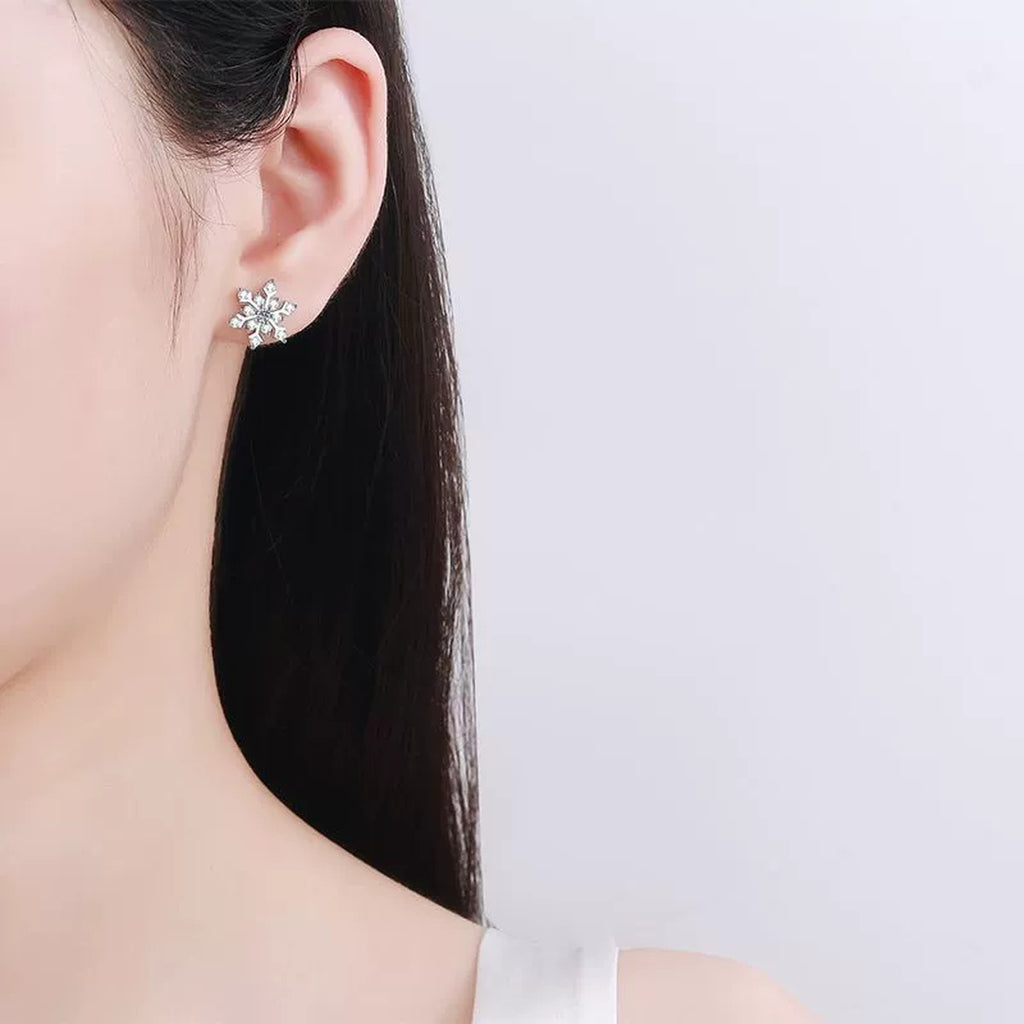 Snowflake Moissanite Stud Earrings in Rhodium-Plated S925 sterling silver worn on ear by model showing scale, placement, and stud earrings styling