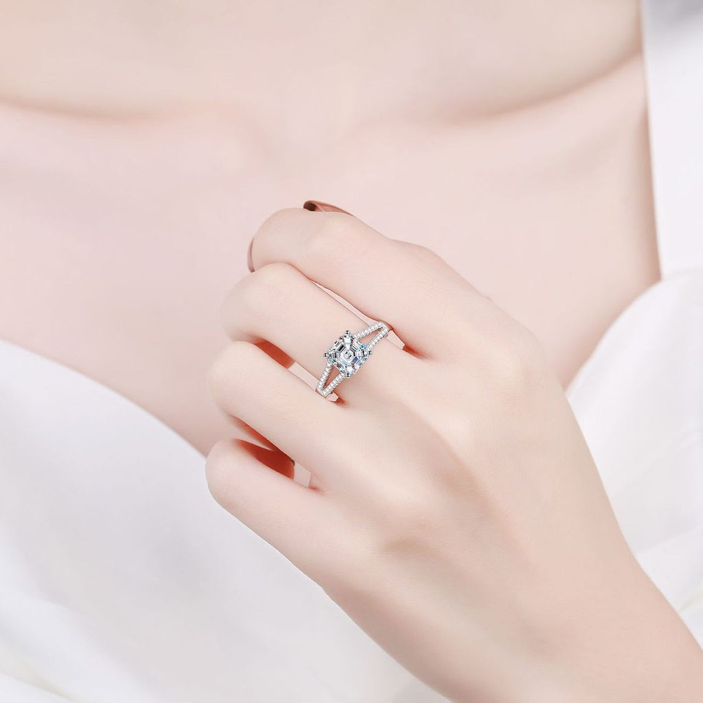 Princess Cut Moissanite Side Stone Engagement Ring with CZ worn on hand to show scale, band width, and ring profile
