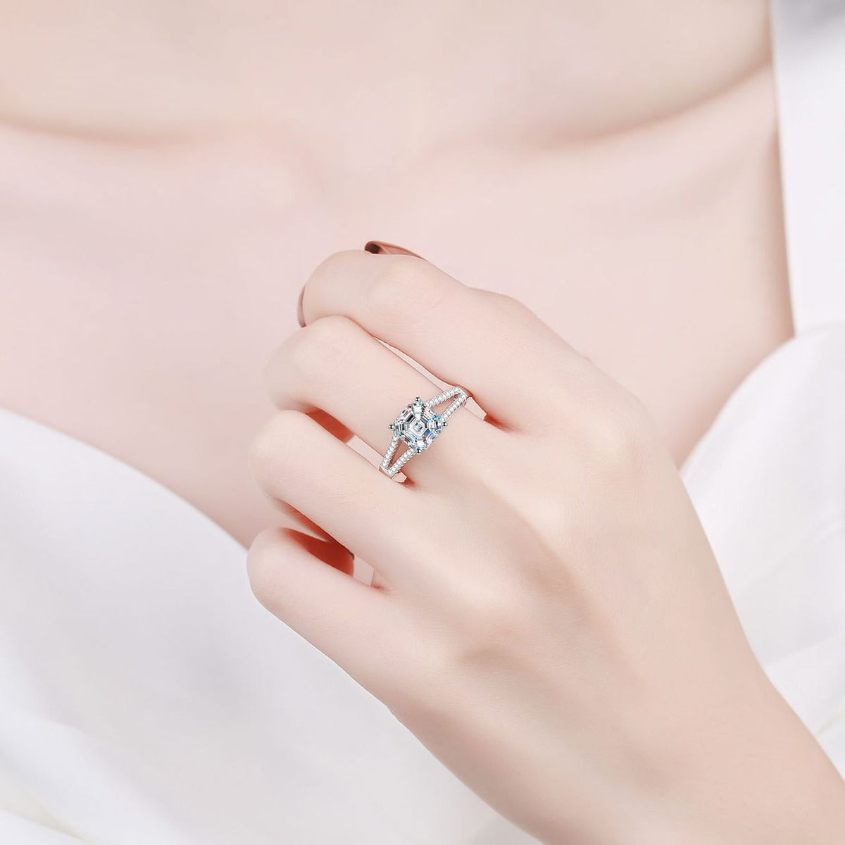 Princess Cut Moissanite Side Stone Engagement Ring with CZ worn on hand to show scale, band width, and ring profile
