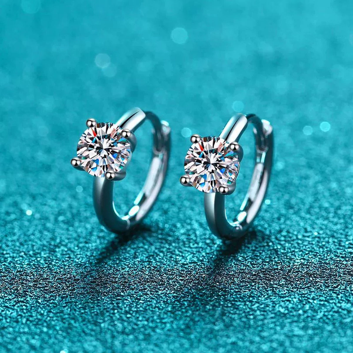 Round Moissanite Huggie Hoop Earrings in Rhodium-Plated S925 sterling silver product scene view showing front sparkle