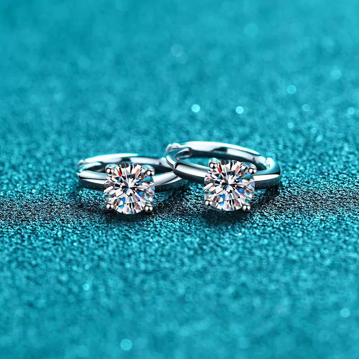 Round Moissanite Huggie Hoop Earrings in Rhodium-Plated S925 sterling silver product scene view showing angled setting detail