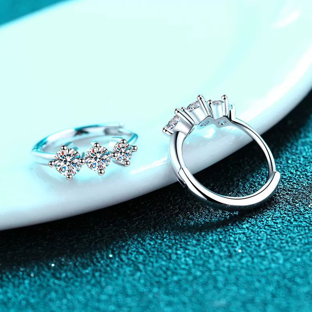 Graduated Moissanite Huggie Hoop Earrings in Rhodium-Plated S925 sterling silver product scene view showing side profile
