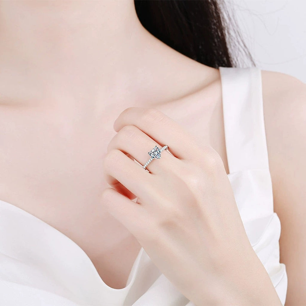 Heart Cut Moissanite Ring with CZ worn on hand to show scale and ring profile