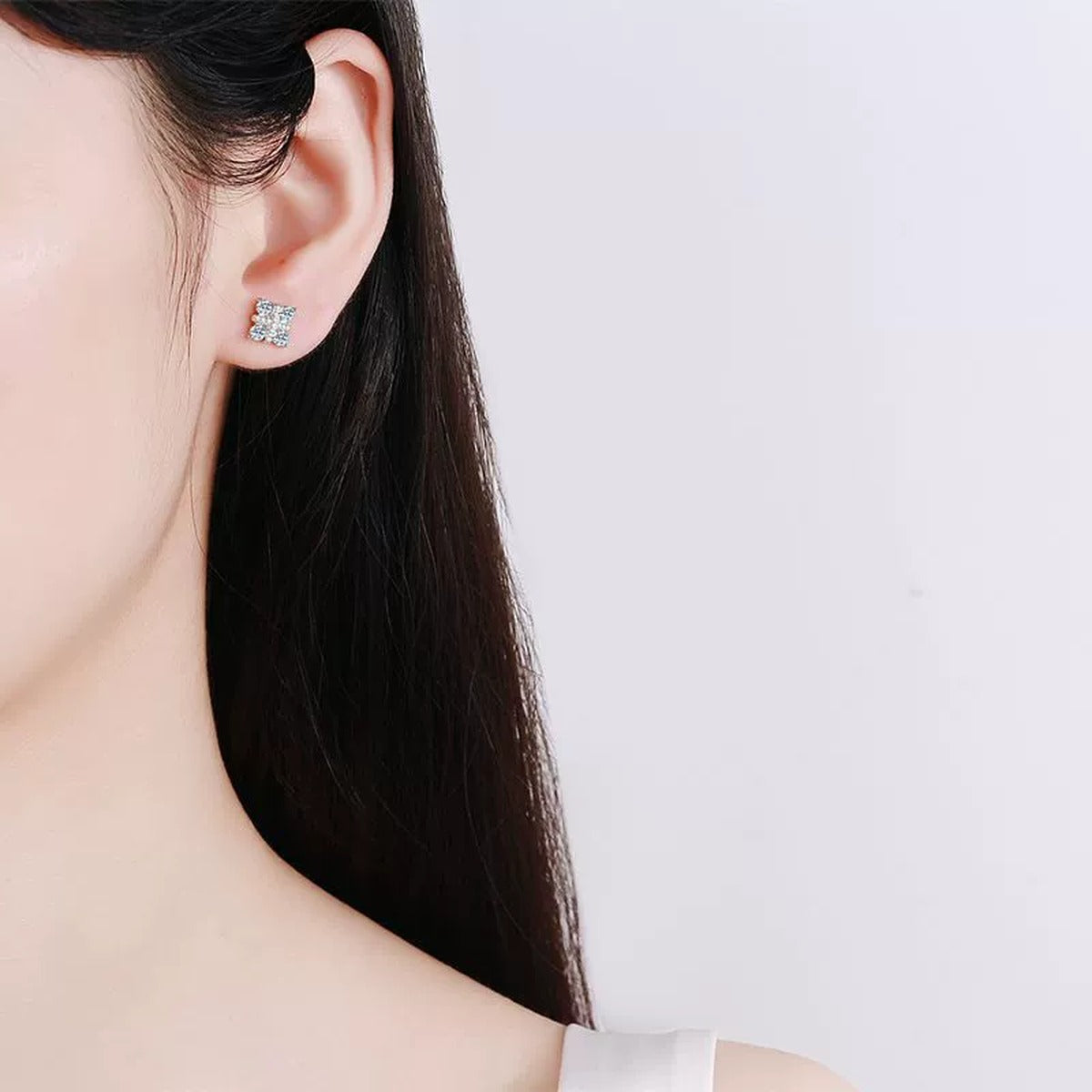 Square Cluster Moissanite Stud Earrings with CZ in Rhodium-Plated S925 sterling silver worn on ear by model showing scale, placement, and stud earrings styling