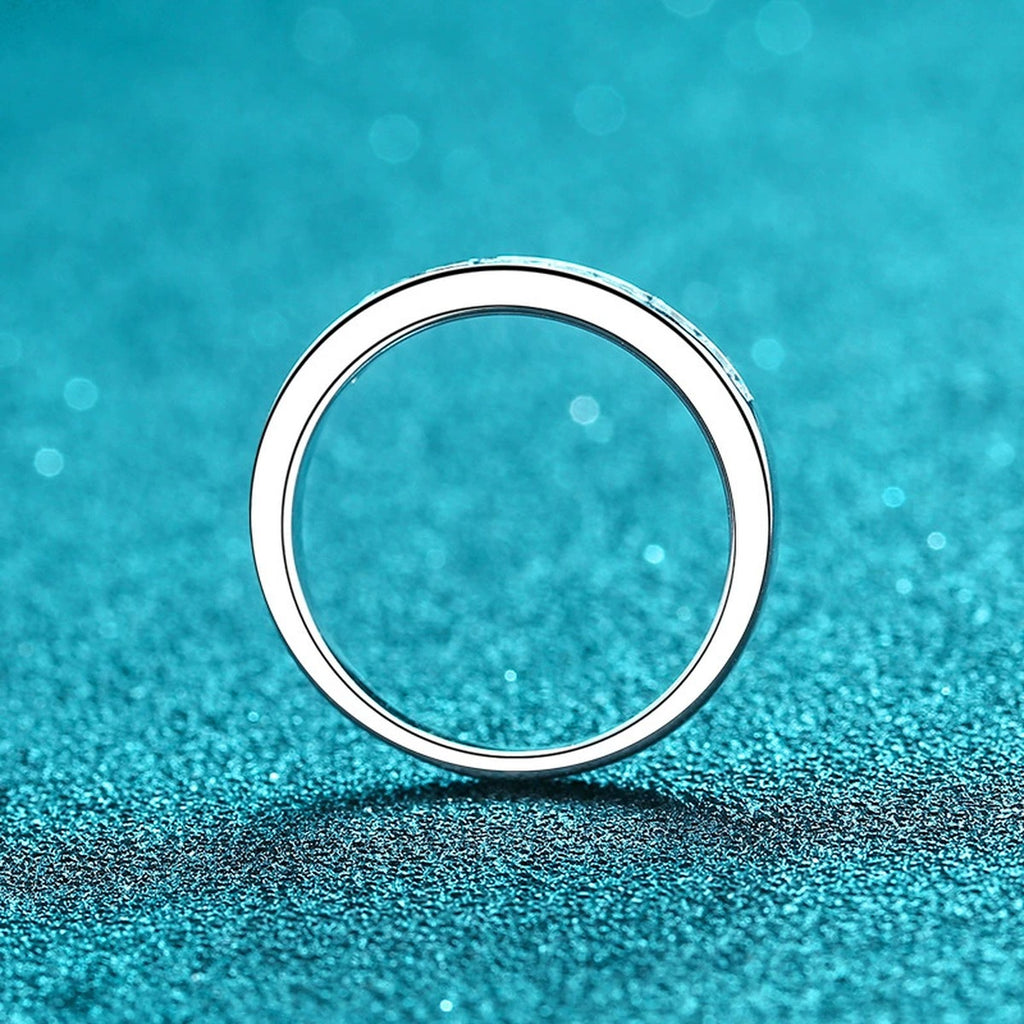 Round Moissanite Twist Ring product view showing moissanite setting and rhodium finish