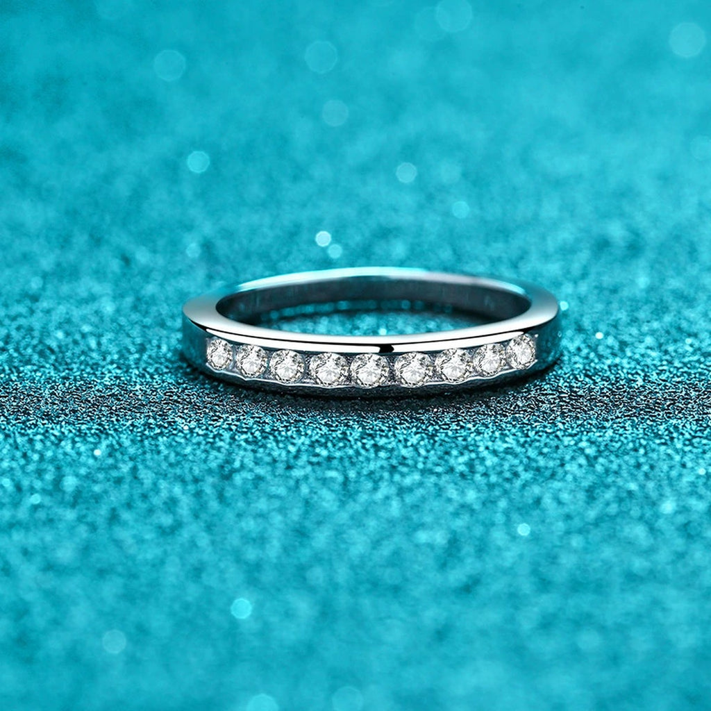 Round Moissanite Twist Ring product view showing moissanite setting and rhodium finish
