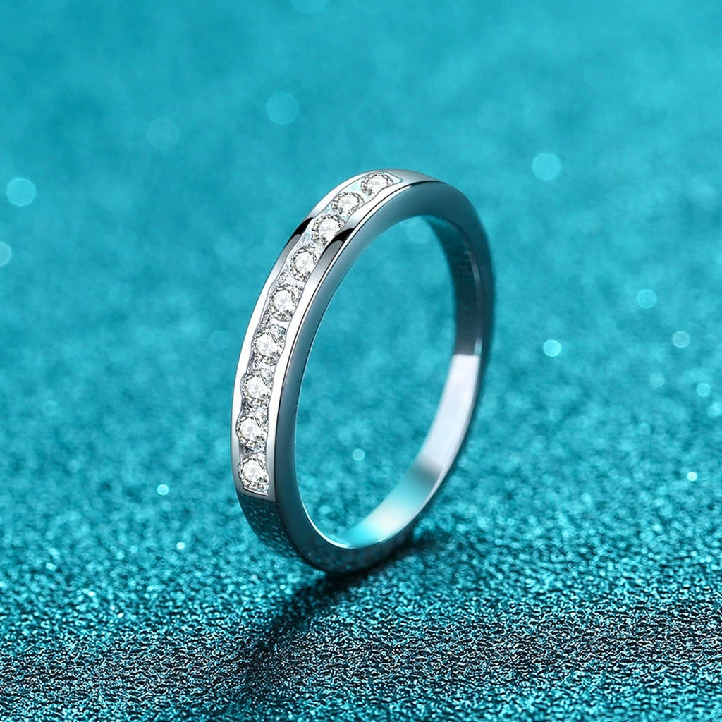 Round Moissanite Twist Ring product view showing moissanite setting and rhodium finish