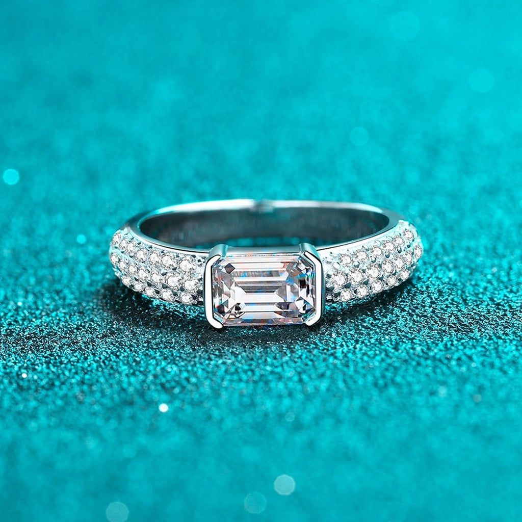 Emerald and Radiant Cut Moissanite Side Stone Engagement Ring with CZ product view showing moissanite setting and metal finish