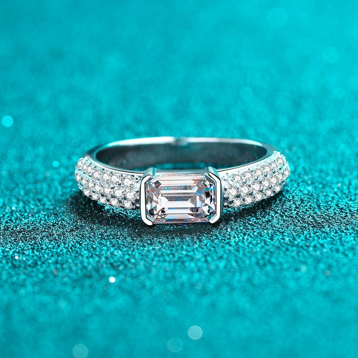Emerald and Radiant Cut Moissanite Side Stone Engagement Ring with CZ product view showing moissanite setting and metal finish