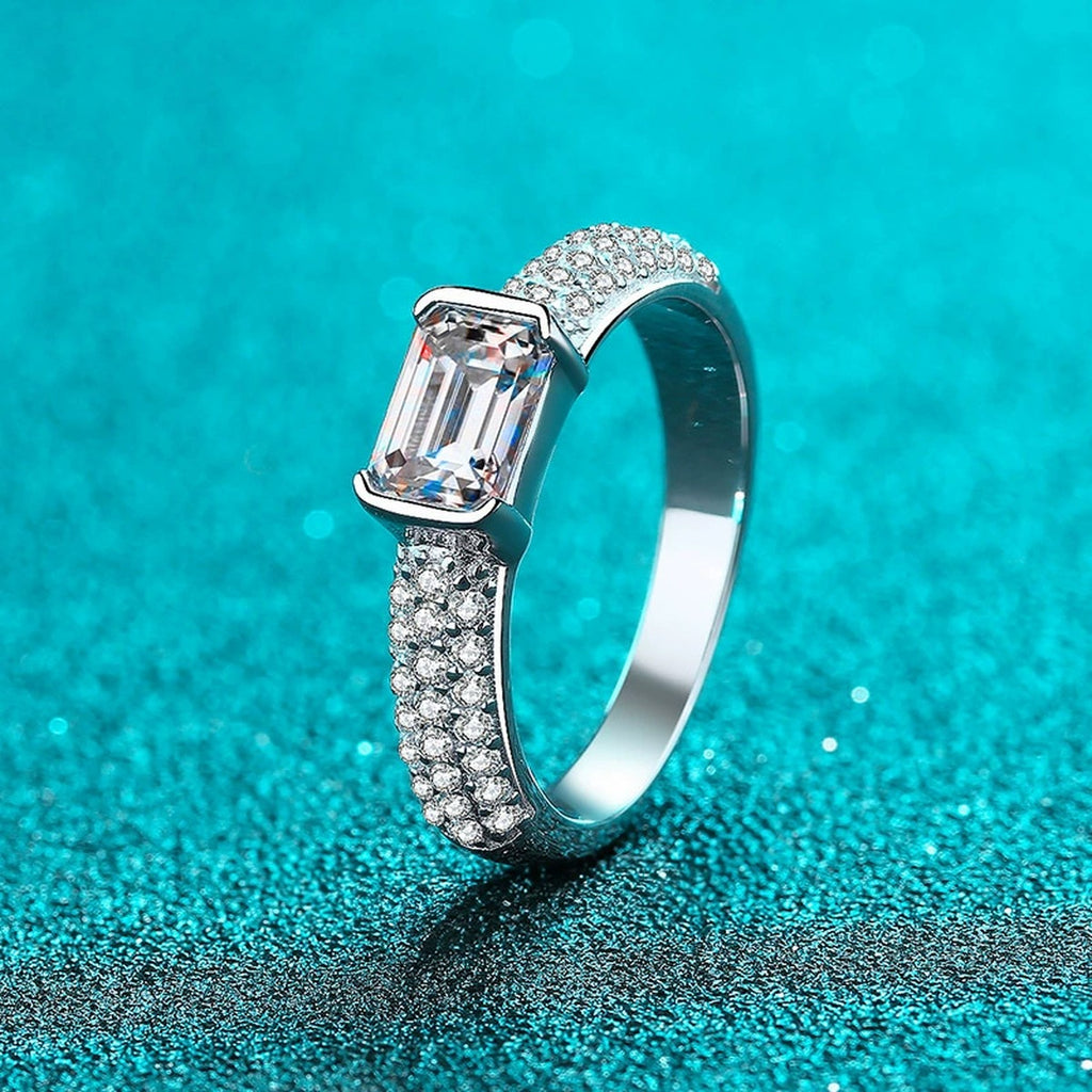 Emerald and Radiant Cut Moissanite Side Stone Engagement Ring with CZ product view showing moissanite setting and metal finish