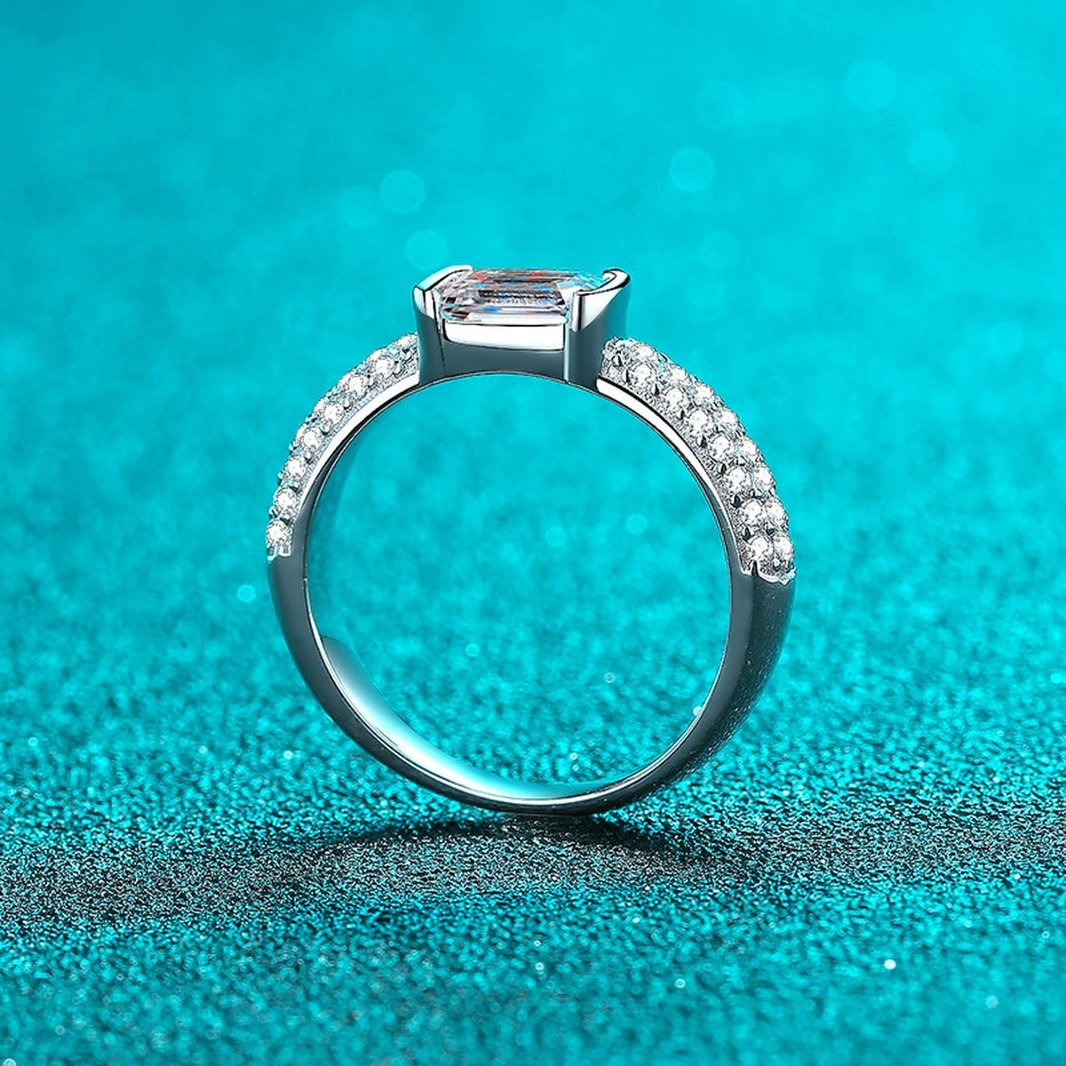 Emerald and Radiant Cut Moissanite Side Stone Engagement Ring with CZ product view showing moissanite setting and metal finish