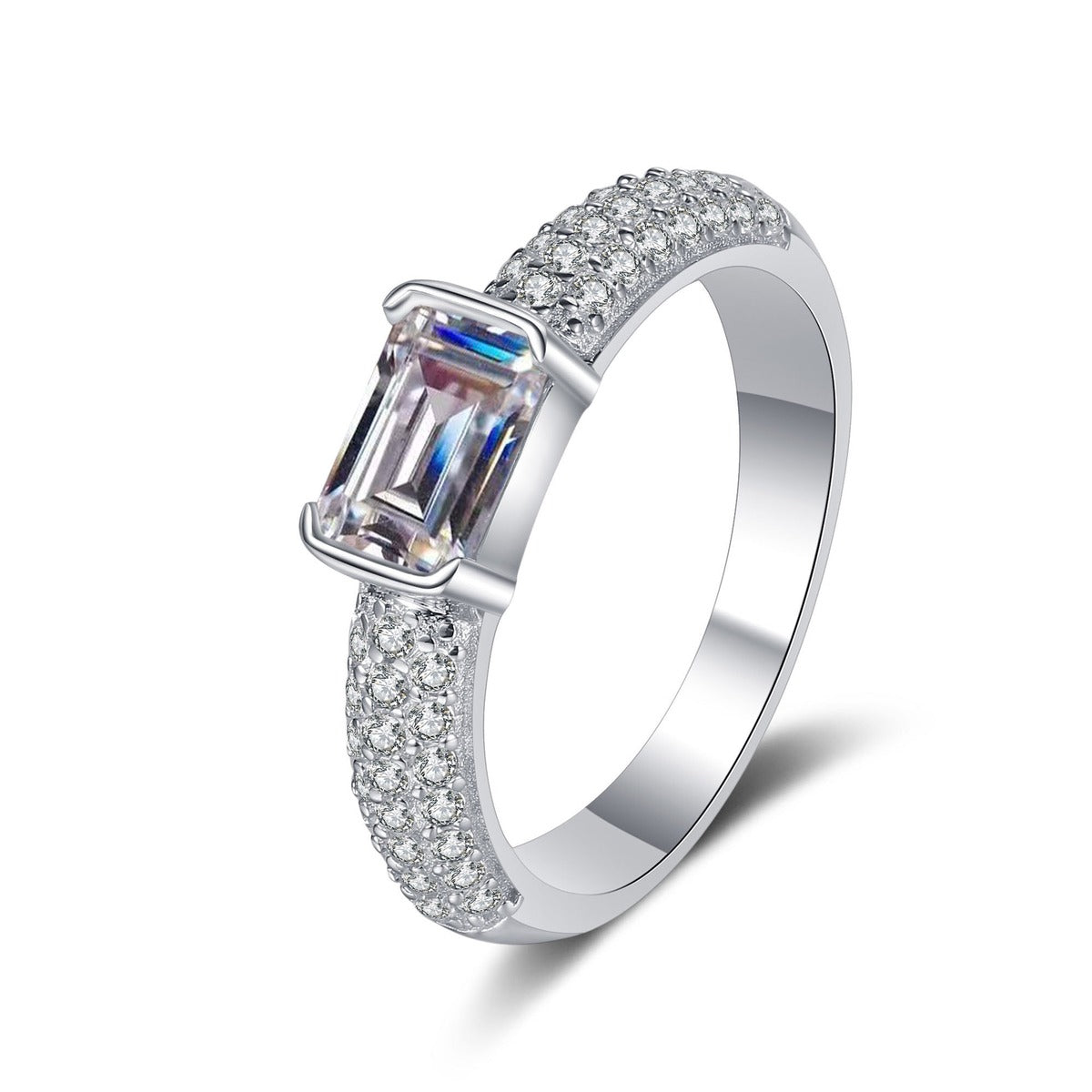 Emerald and Radiant Cut Moissanite Side Stone Engagement Ring with CZ in rhodium-plated S925 sterling silver on clean white background