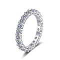 Round Moissanite Eternity Band Ring in rhodium-plated S925 sterling silver on clean white background