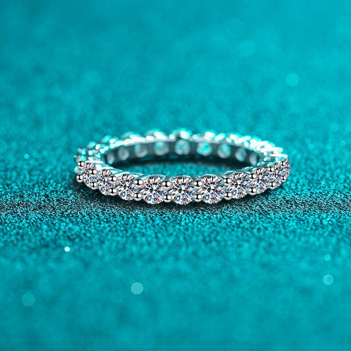 Round Moissanite Eternity Band Ring product view showing moissanite setting and rhodium finish
