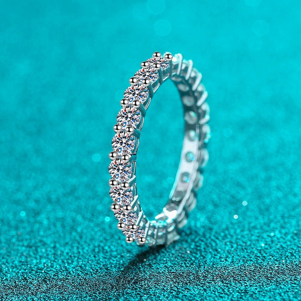 Round Moissanite Eternity Band Ring product view showing moissanite setting and rhodium finish