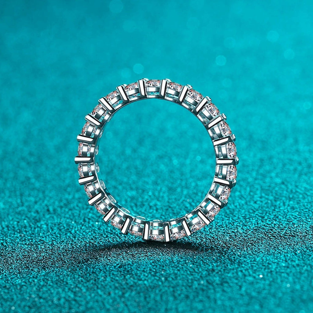 Round Moissanite Eternity Band Ring product view showing moissanite setting and rhodium finish