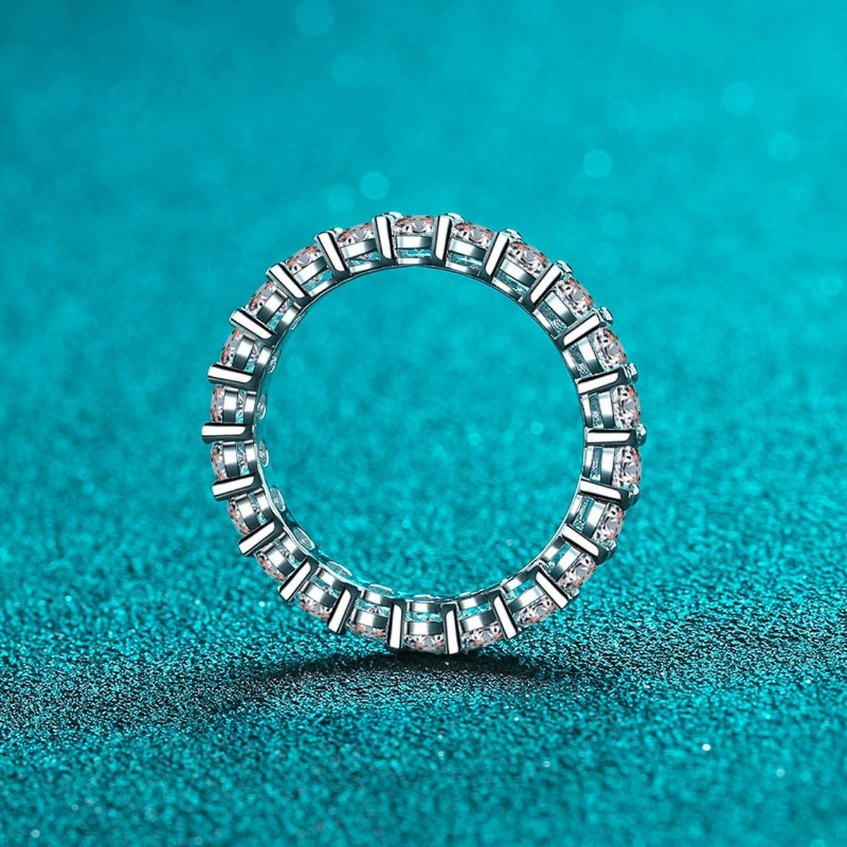 Round Moissanite Eternity Band Ring product view showing moissanite setting and rhodium finish