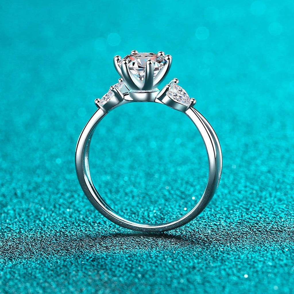 Round Moissanite Side Stone Engagement Ring with CZ product view showing moissanite setting and metal finish